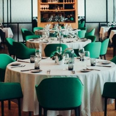 restaurant interior design with green chairs